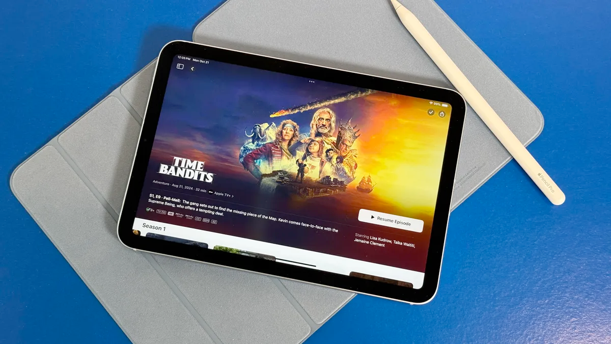 A high-end tablet display showing real-time insurance premium comparisons with safety scores
